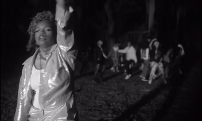 a black and white photo of a woman dancing