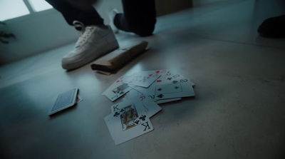 a pile of playing cards sitting on top of a table