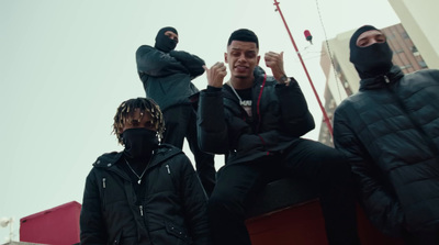 a group of men sitting on top of a building