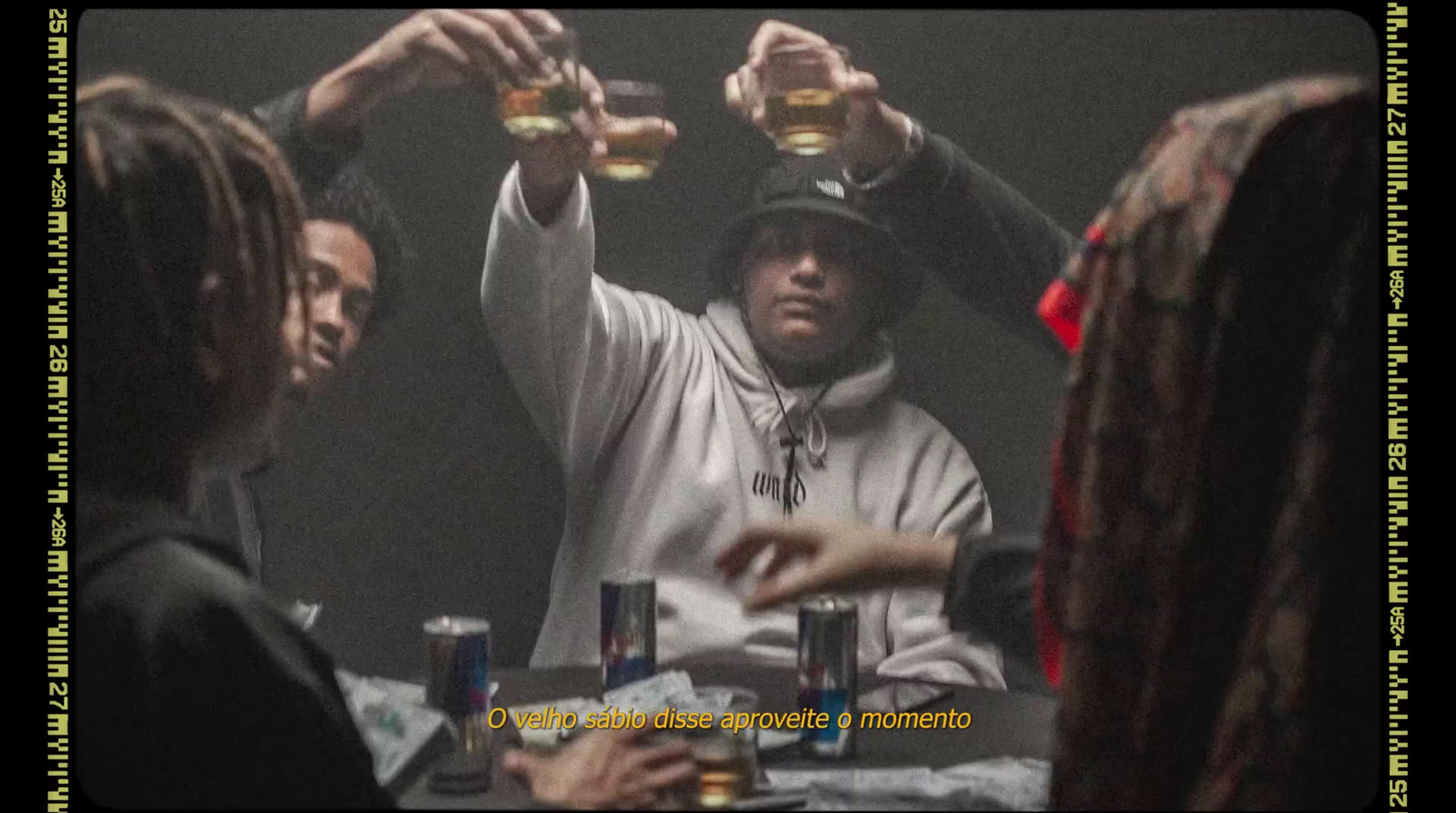 a group of people sitting around a table with drinks