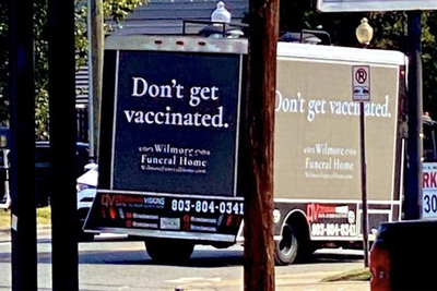 a delivery truck driving down a city street