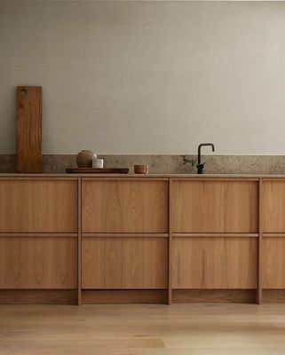 a kitchen with wooden cabinets and a sink