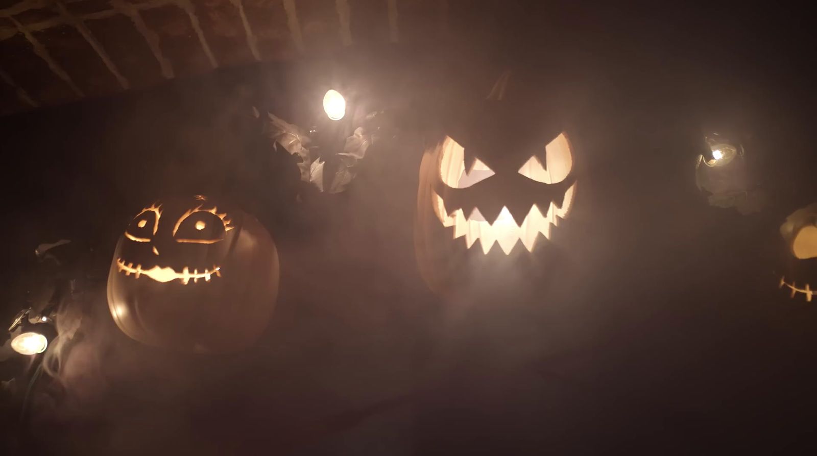 a group of jack o lantern pumpkins glowing in the dark