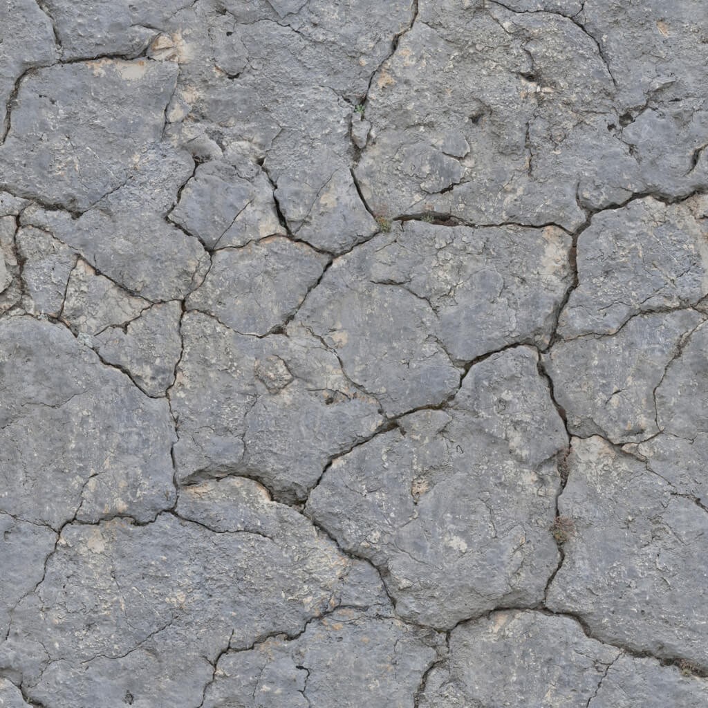 a close up of a rock surface with cracks