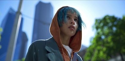 a young man with blue hair wearing a hoodie