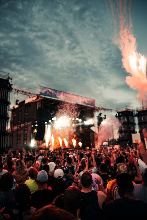 a crowd of people at a music festival