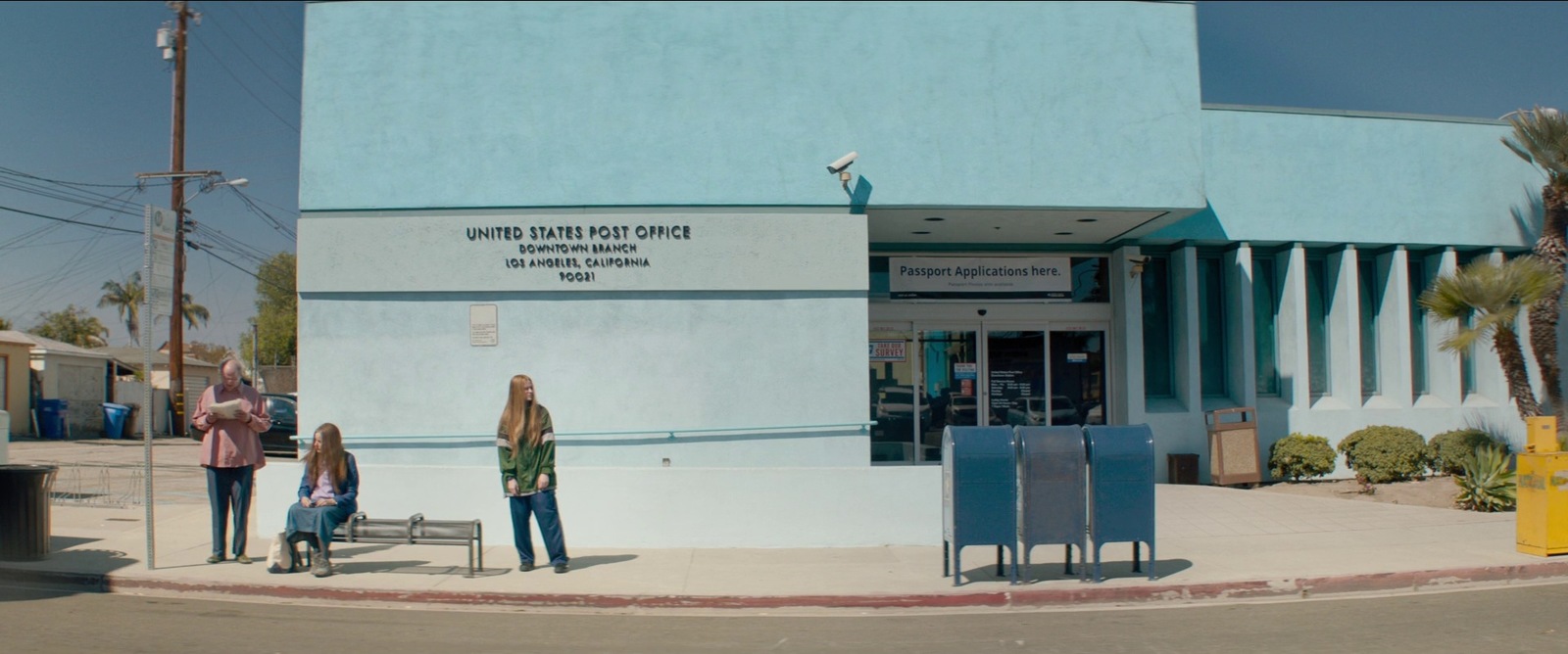 a group of people standing outside of a building