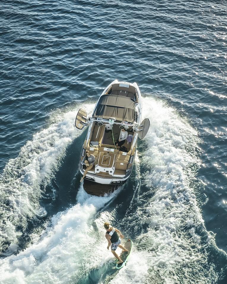 a couple of people riding on the back of a boat