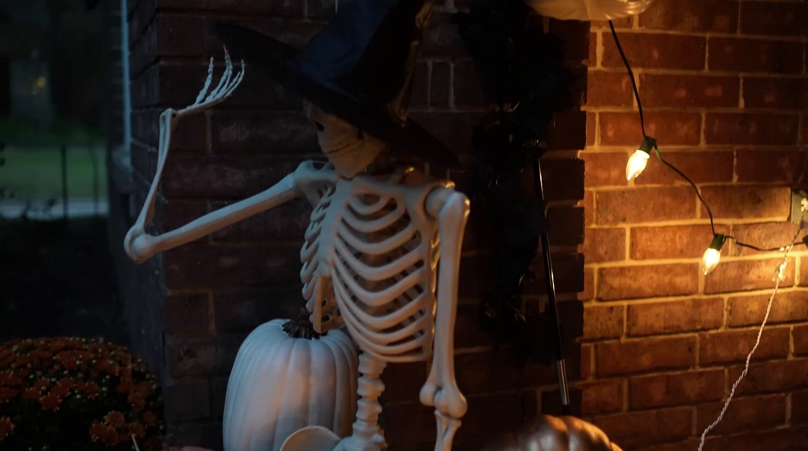 a skeleton with a hat and a top hat on