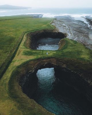 an aerial view of a body of water surrounded by land