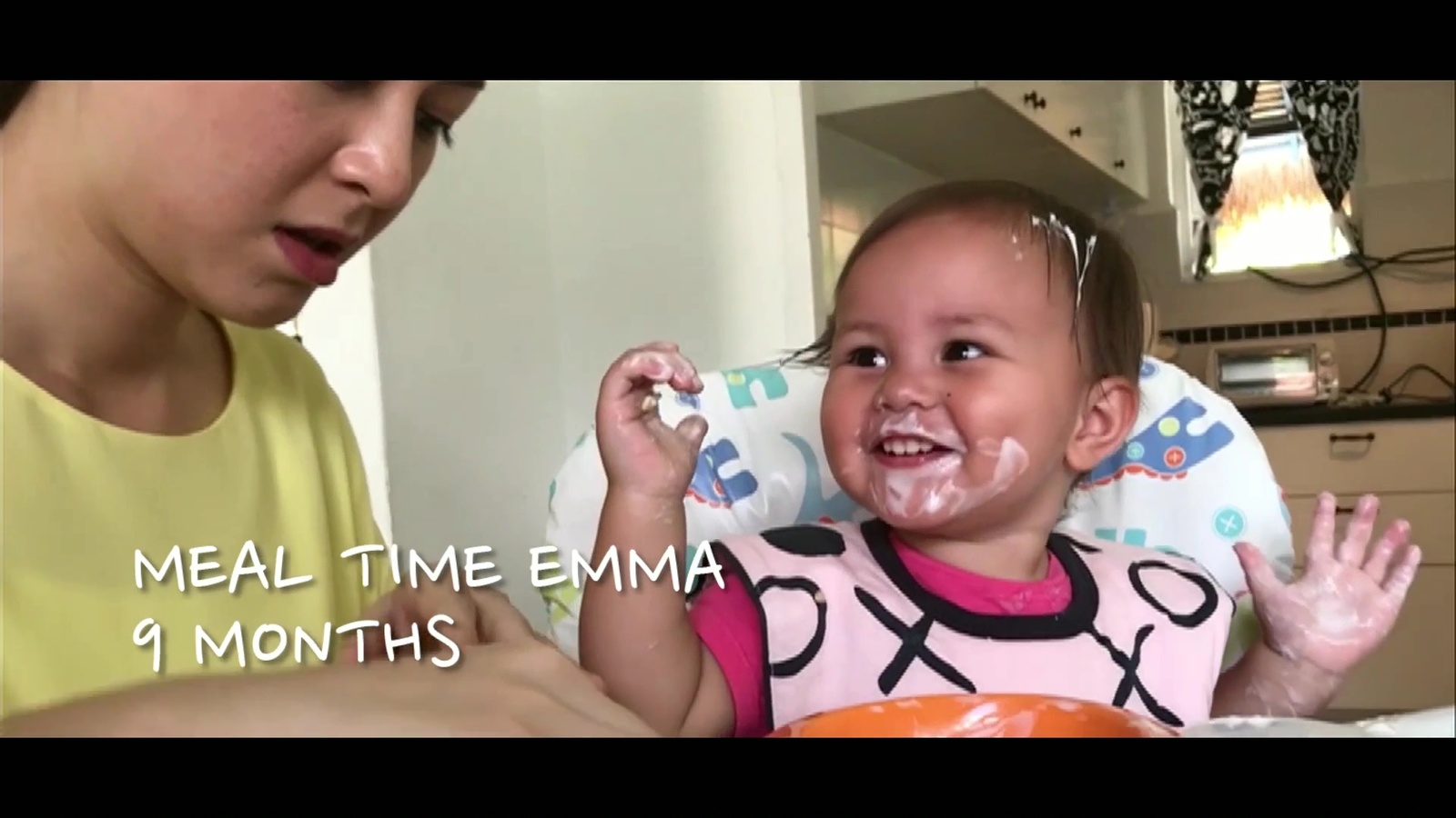 a baby with a messy face is being held by a woman