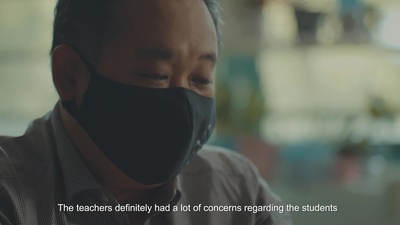 a man wearing a black face mask with a quote on it