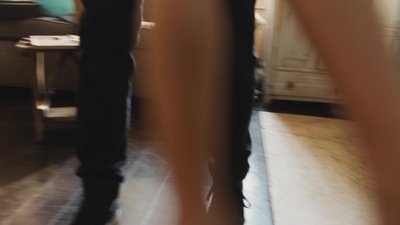 a blurry photo of a person standing in a living room