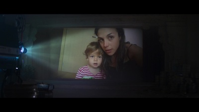 a woman and a child on a television screen