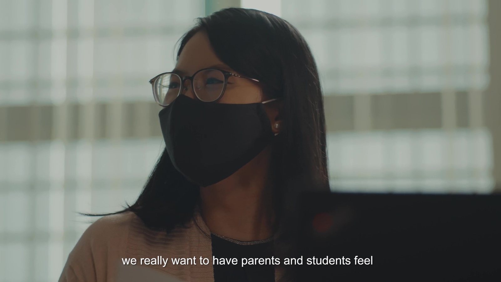 a woman wearing a face mask with a quote on it