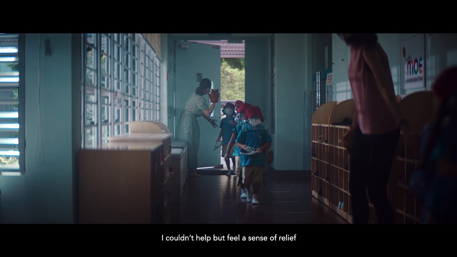 a group of children standing in a hallway