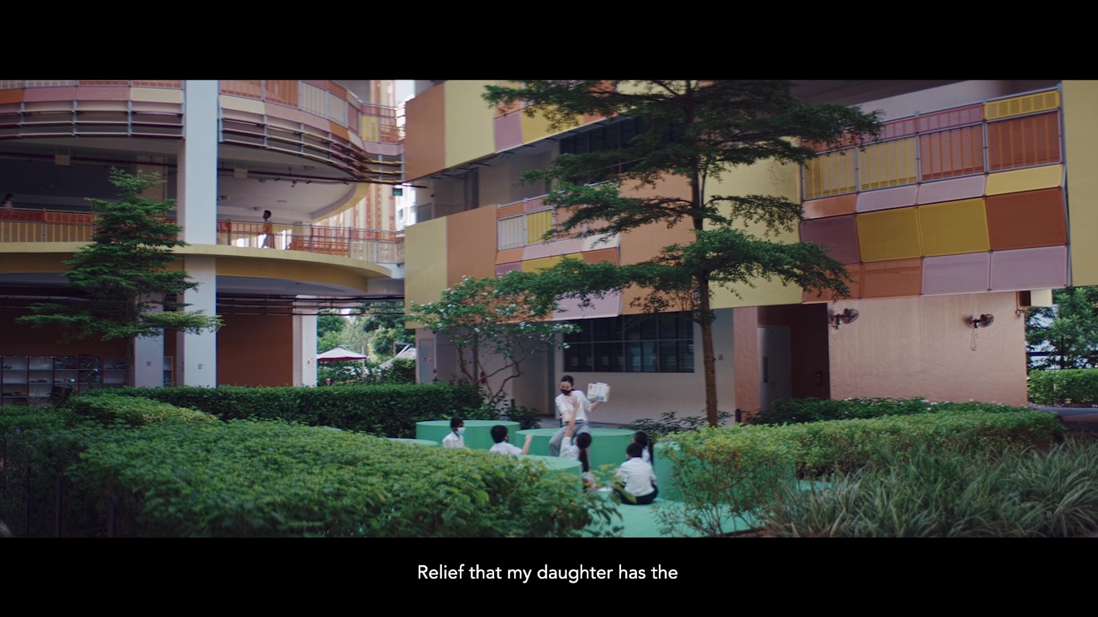 a couple of people that are standing in front of a building