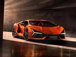 an orange sports car parked in a tunnel