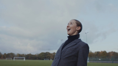 a man standing in a field with his mouth open