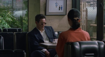 a man sitting at a table with a woman