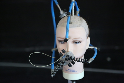 a mannequin's head with wires attached to it