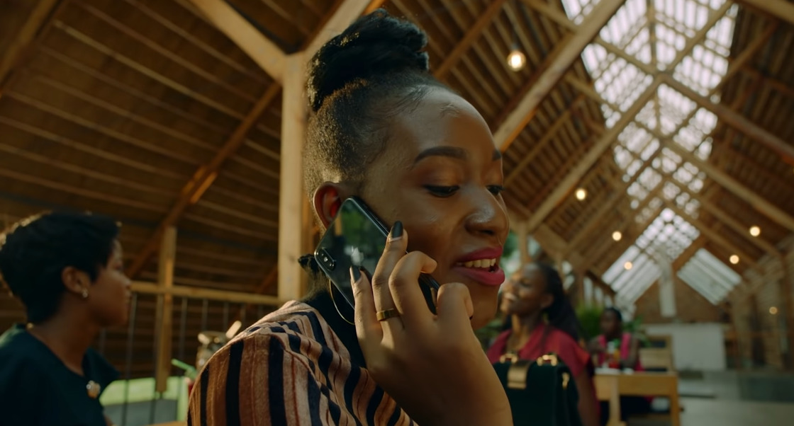 a woman talking on a cell phone in a building