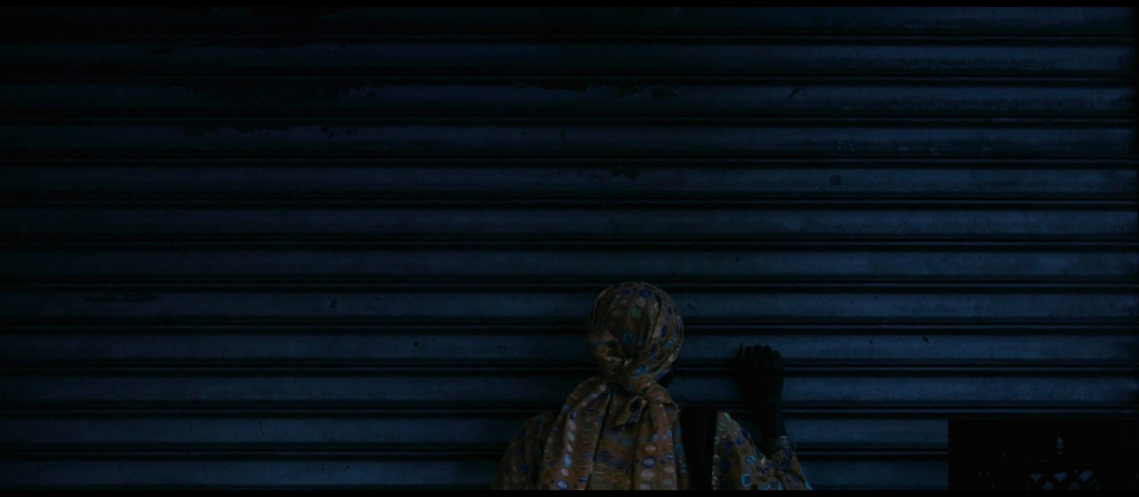 a woman standing in front of a garage door