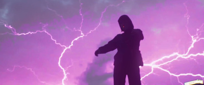 a person standing in front of a purple sky with lightning