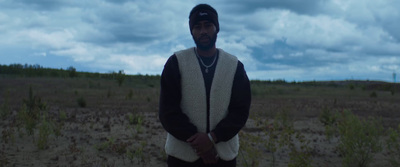 a man standing in the middle of a field