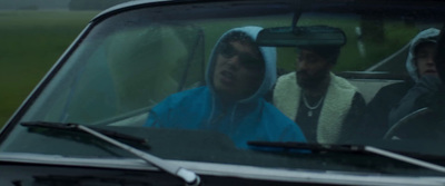 a group of people sitting in the back of a car