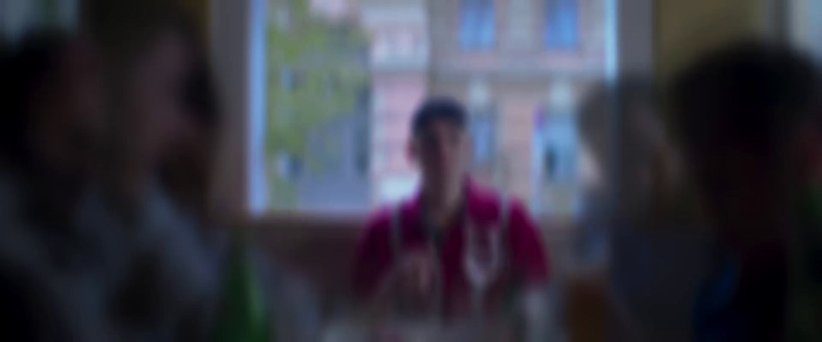 a blurry photo of a person standing in front of a window