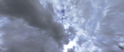 a cloudy sky with a plane flying in the distance