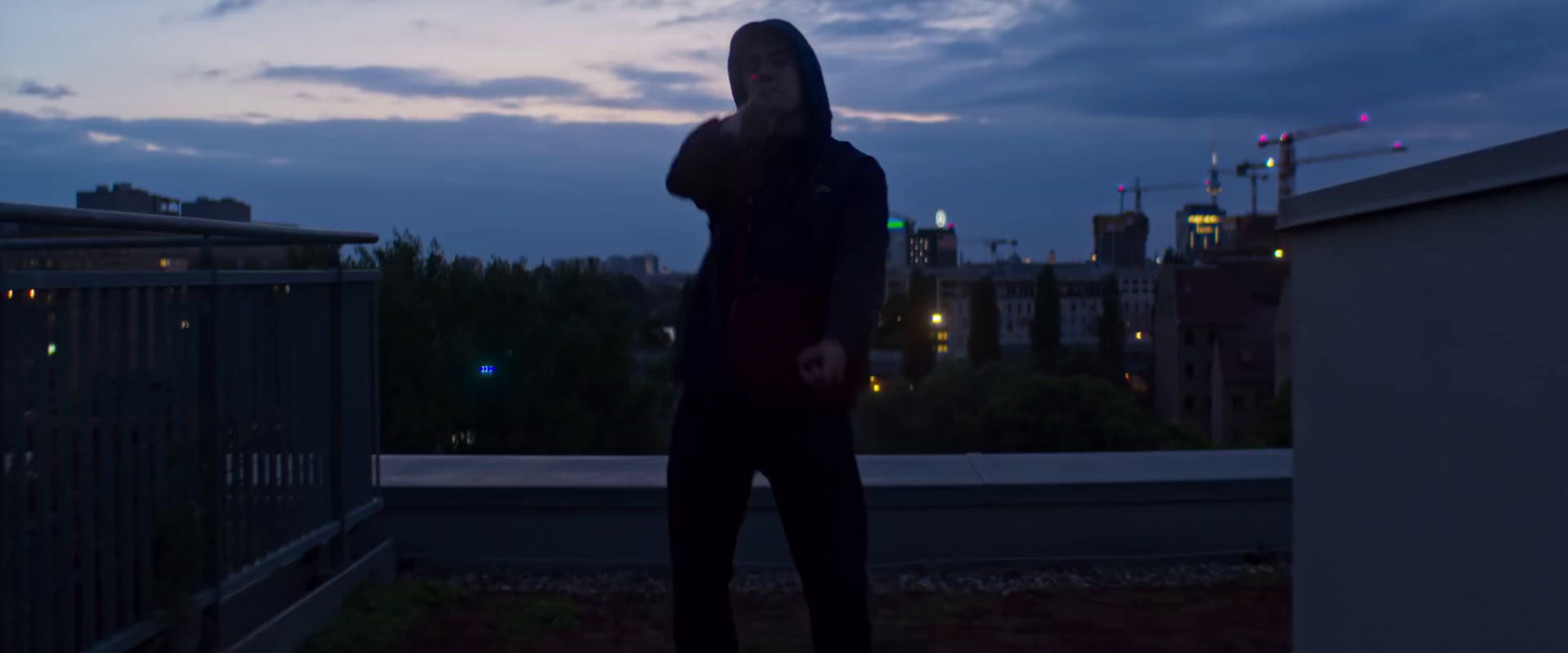 a person standing on a roof at night