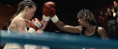 two women boxing in a boxing ring