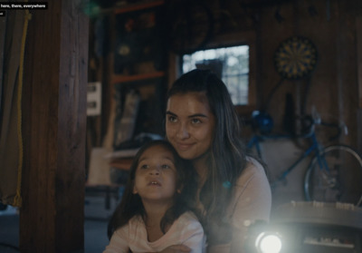 a woman and a young girl sitting next to each other