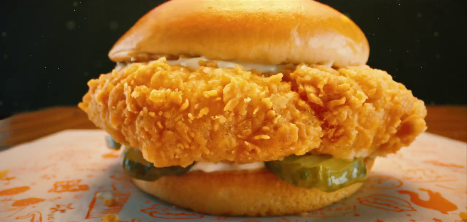 a close up of a chicken sandwich on a table