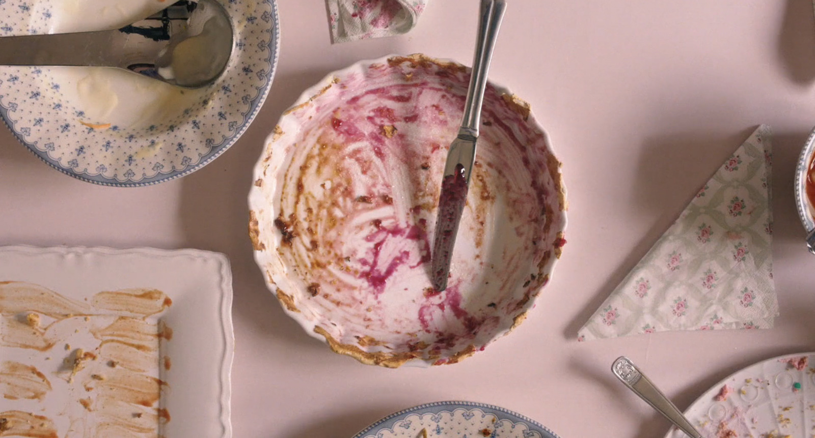 a table topped with plates and bowls filled with food