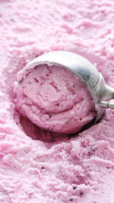 a scoop of pink ice cream in a bowl