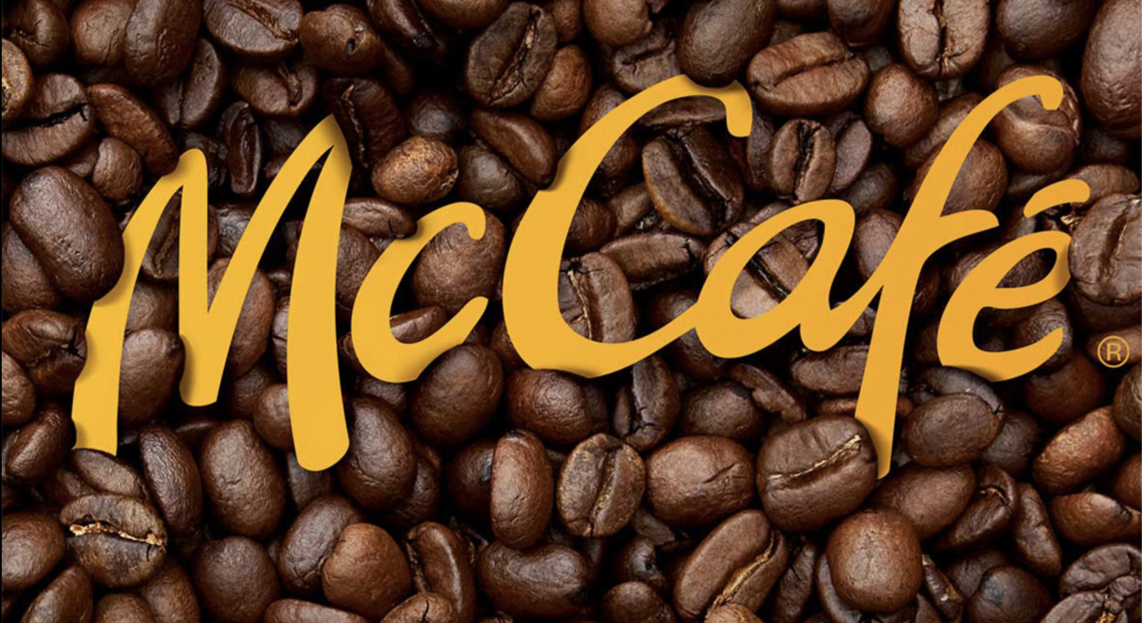 a pile of coffee beans with the word mccaf on it