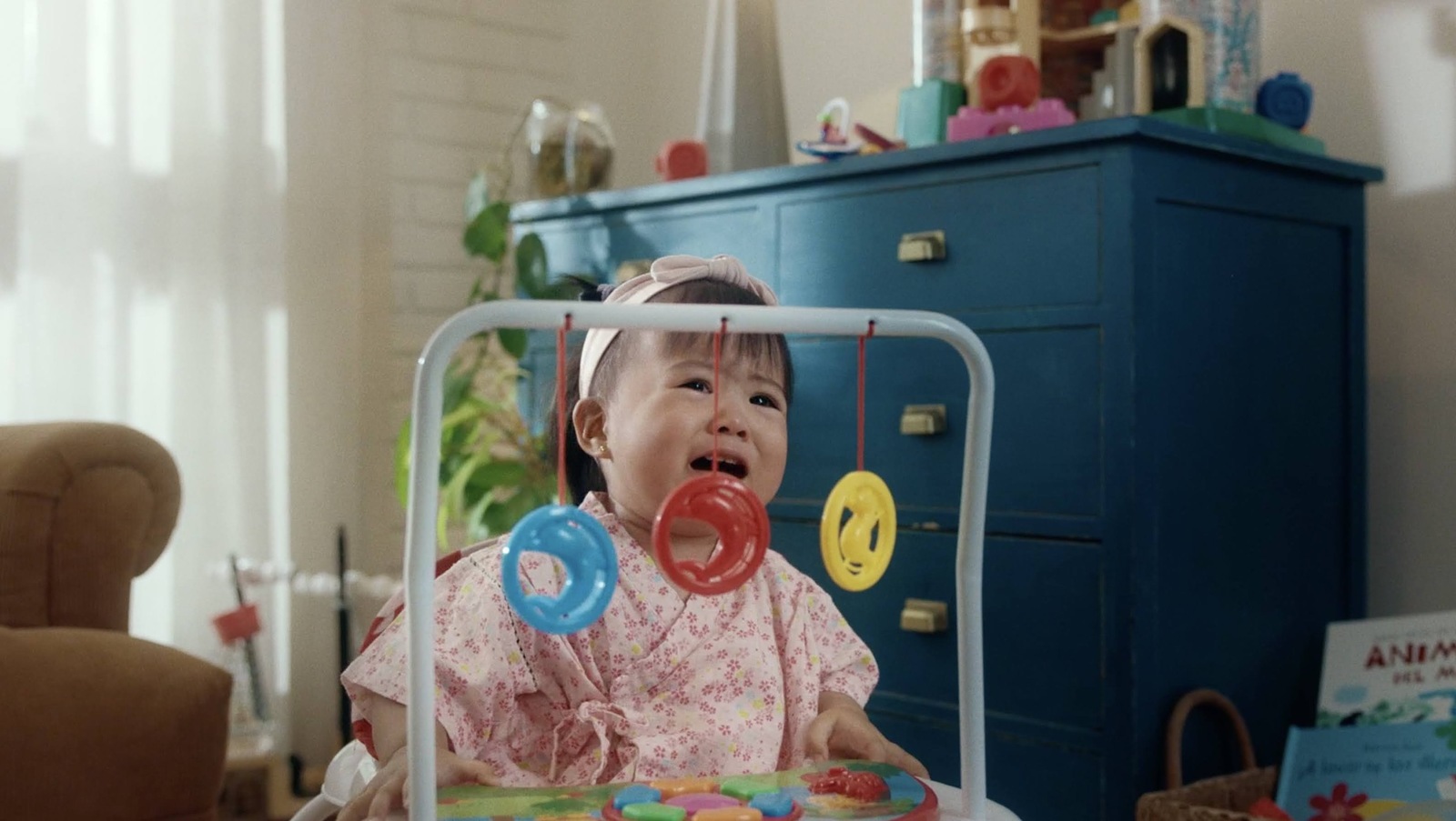 a little girl that is sitting in a chair