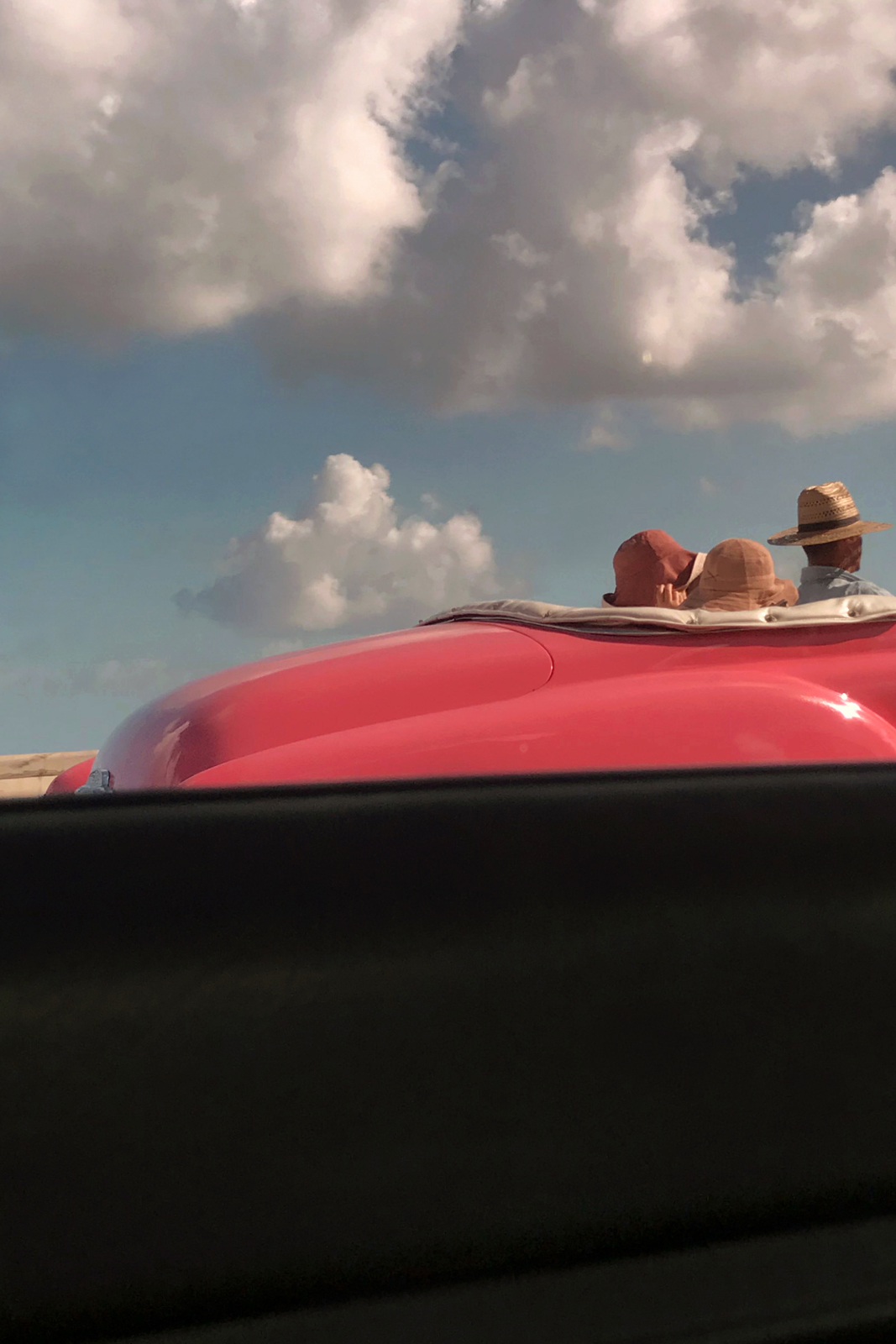 a couple of people that are sitting in a car