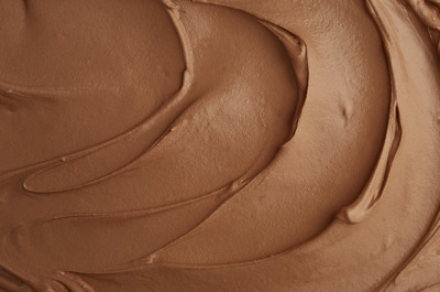 a close up of a chocolate frosted cake