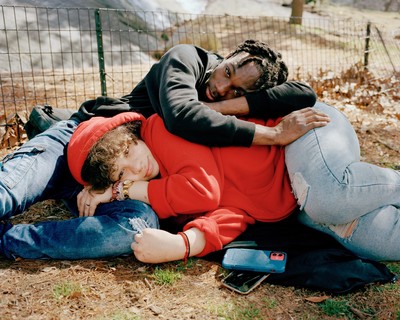 a couple of people that are laying on the ground