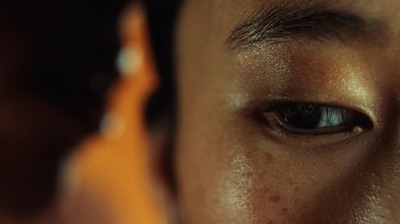 a close up of a person's eye with a blurry background