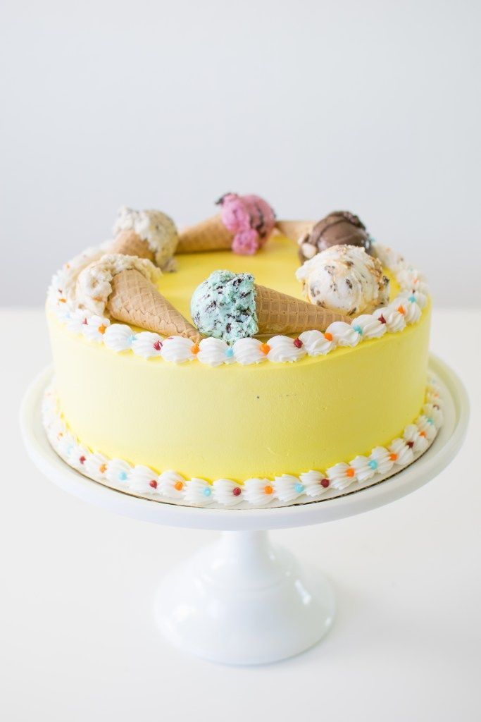 a yellow cake with ice cream on top of it