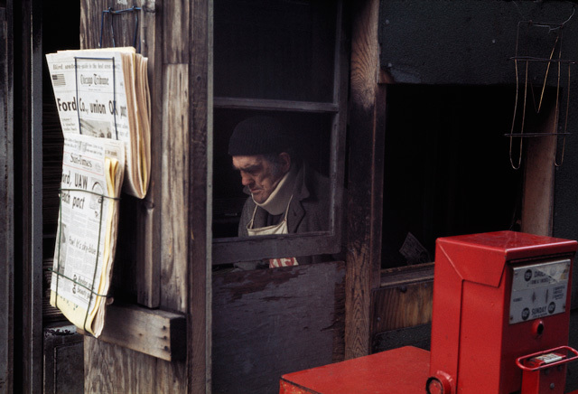 a man is looking out of a window