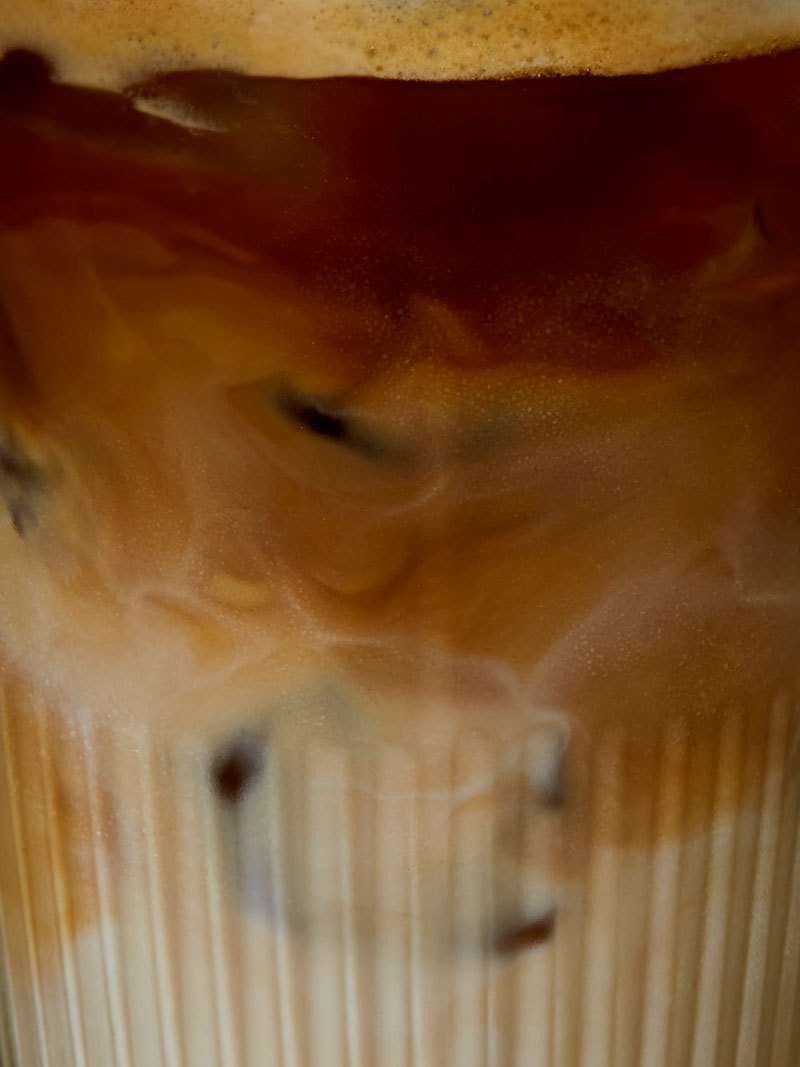 a close up of a cup with liquid in it