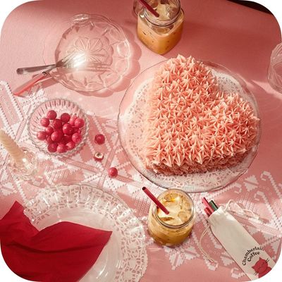 a heart shaped cake sitting on top of a table