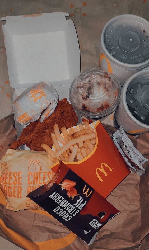 a box of fries and other food on a table