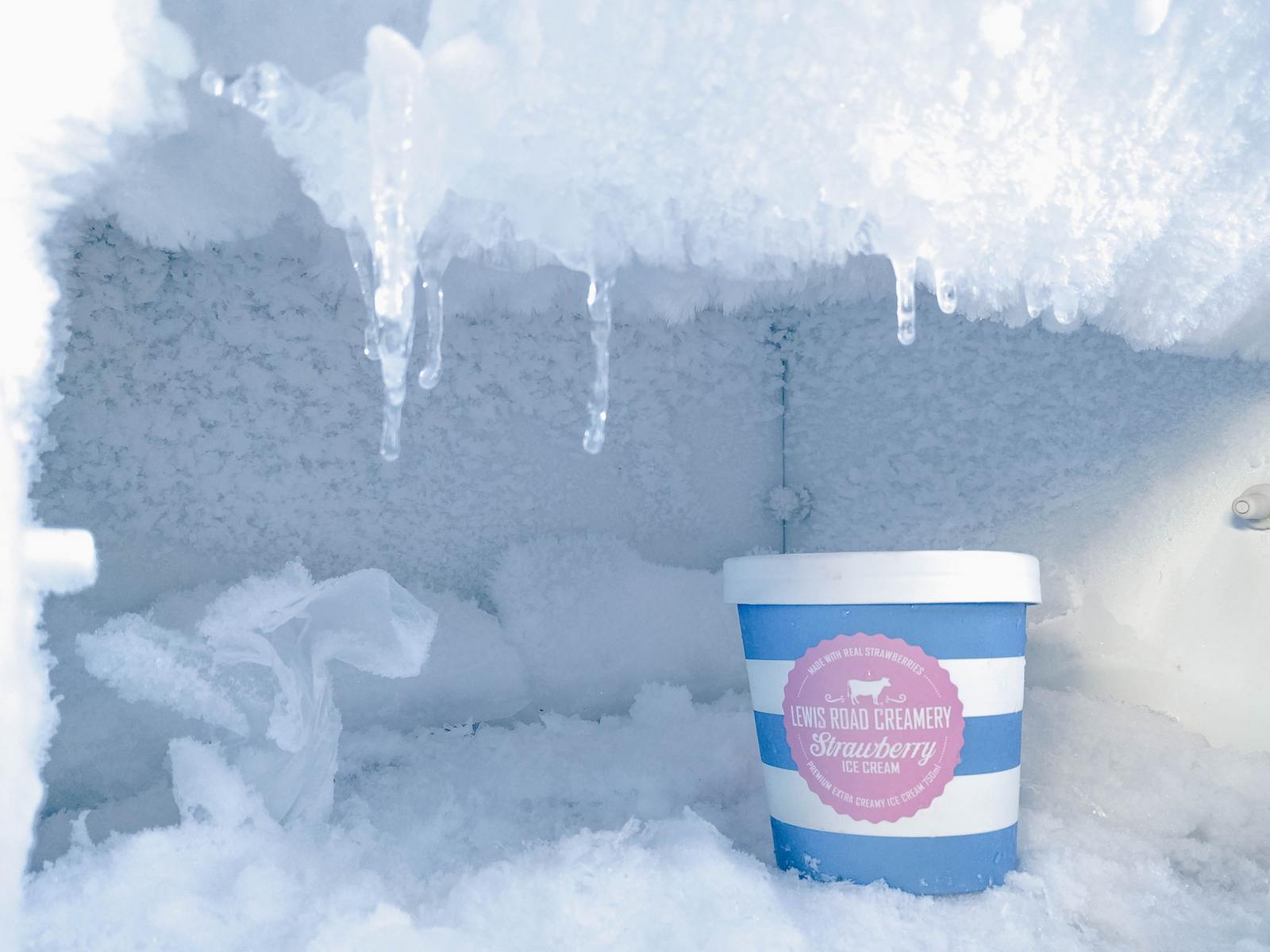 a cup of ice sits in the corner of a room